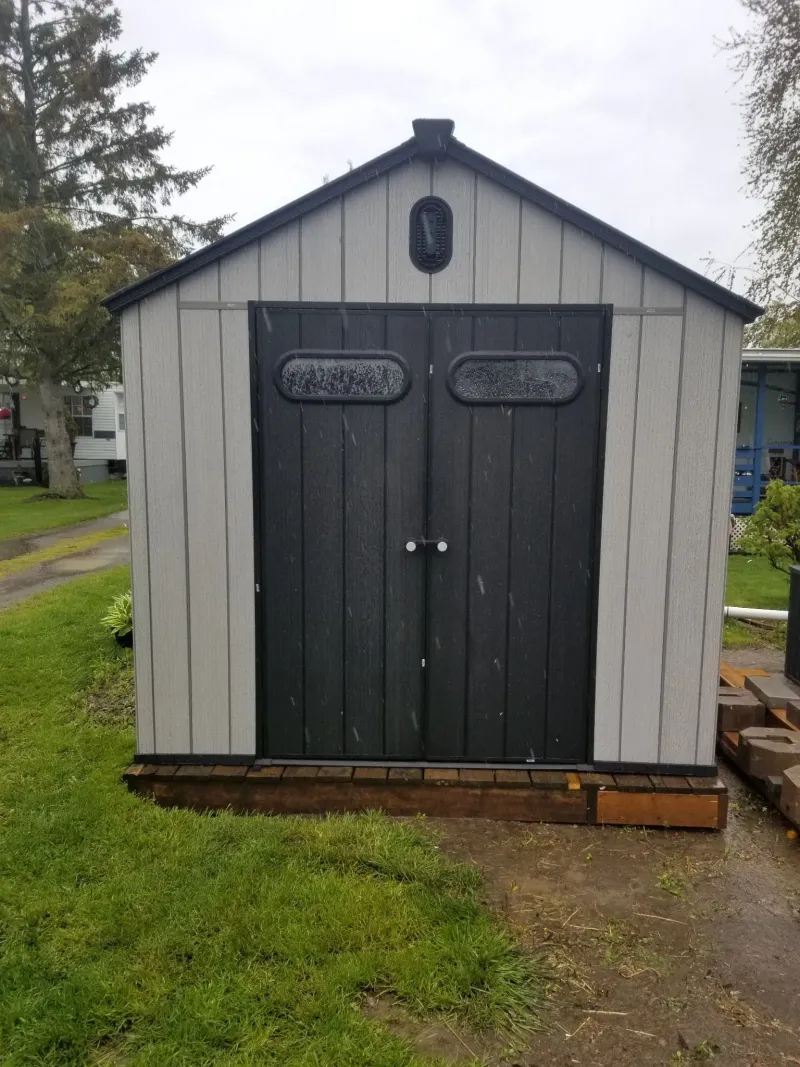 Resin shed angle view in residential setting, Peterborough Ontario