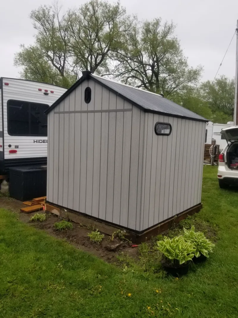 Resin shed side view in backyard, Peterborough Ontario